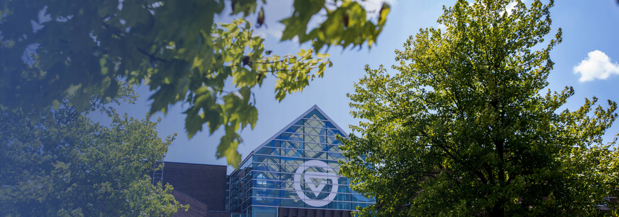 Grand Valley Circle G logo on the glass of a building